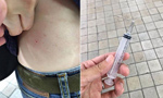 韩国老妇街头将注射器刺入游客身体